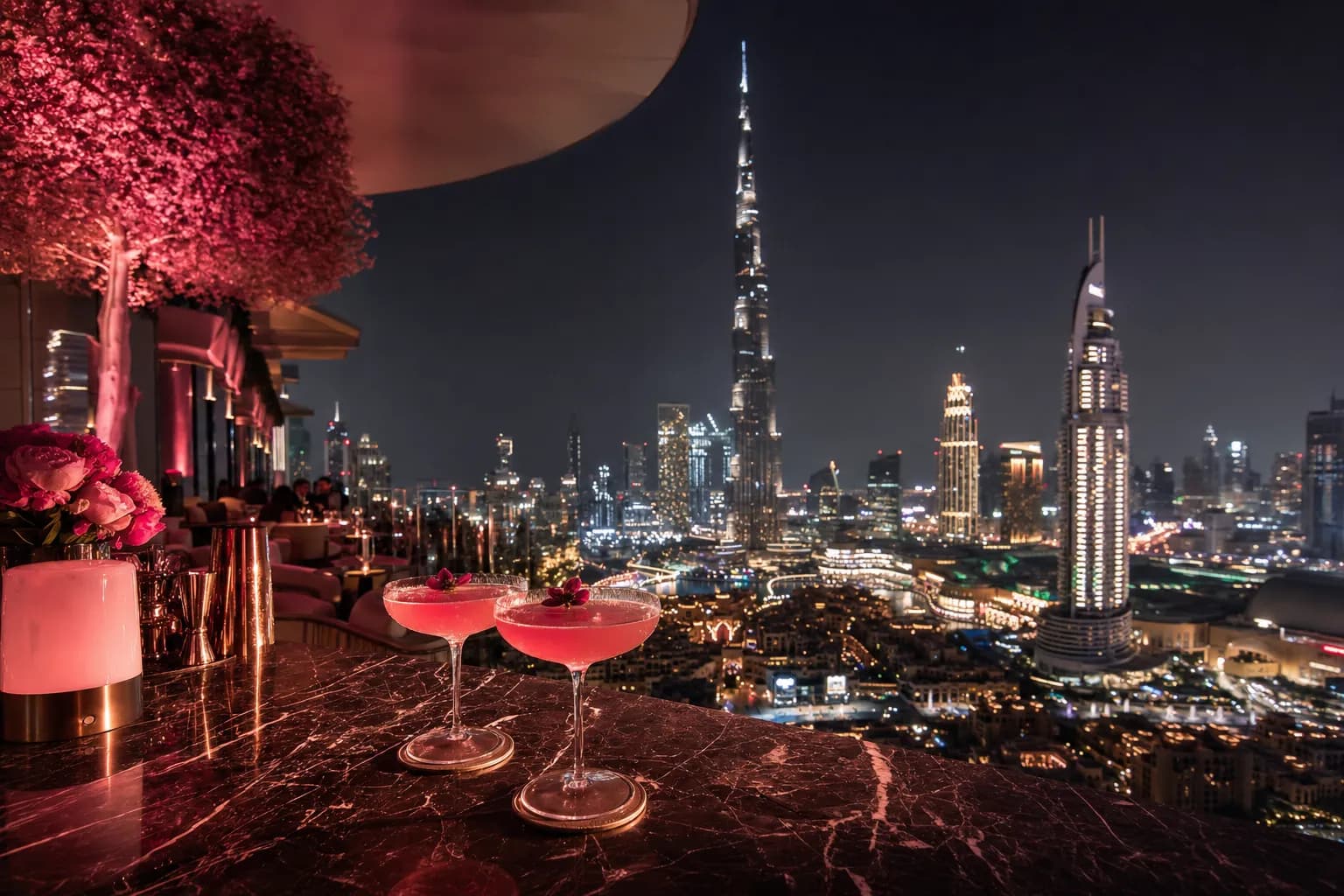 Pink cocktails overlooking the Burj Khalifa skyline from Noor Rooftop, Downtown Dubai